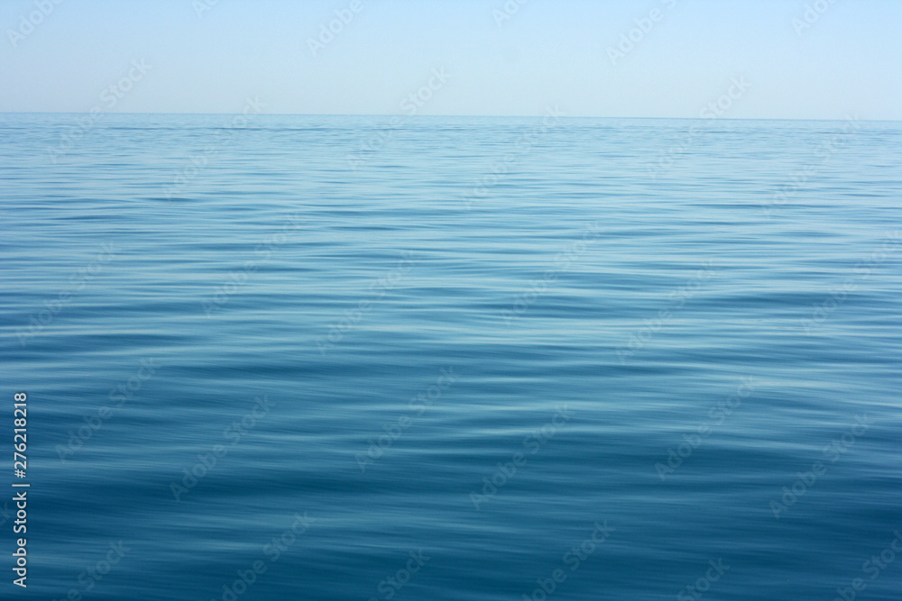 Abstract calm sea or ocean water surface background - obrazy, fototapety, plakaty 
