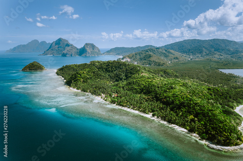 Aerial panoramic view of Palawan amazing coastline, majestic limestone cliffs and sea bay in El Nido, Philippines