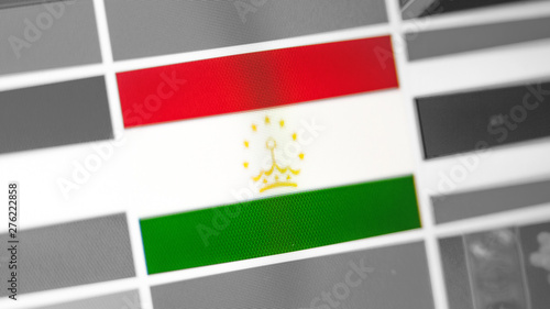 Tajikistan national flag of country.Tajikistan flag on the display, a digital moire effect.