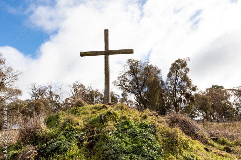 Christian wooden crosses in the Australian outback in a grassy field Christian wooden crosses in the Australian outback in a grassy field