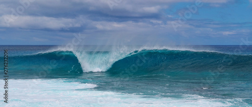 Turquoise breaking wave approaching the shoreline of beautiful Easter Island.