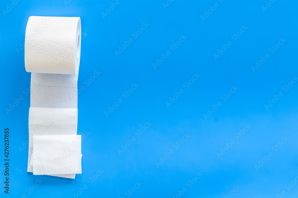 Toilet paper for proctology diseases concept on blue background top view mockup Toilet paper for proctology diseases concept on blue background top view mockup