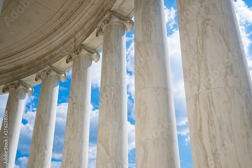 Scenic view of white marble neoclassical columns from the interior of the rotunda at the Jefferson Memorial in Washington DC, USA photo