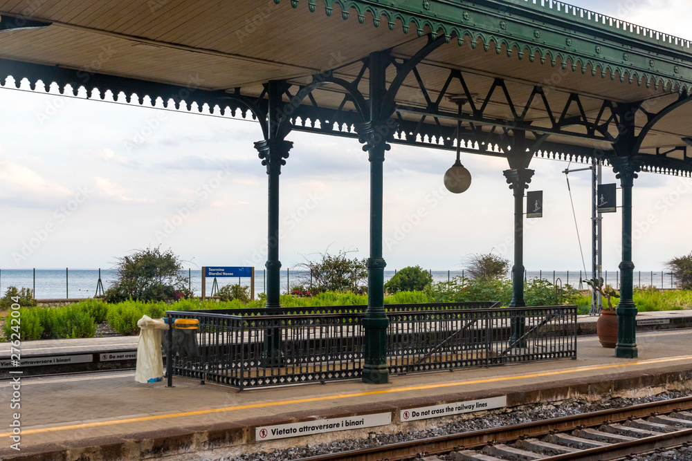 Taormina, Italy - May 14, 2018: Taormina Giardini Naxos railway station (Stazione di Taormina-Giardini), small railway station situated in 1 km away well below the Taormina old town, Sicily, Italy