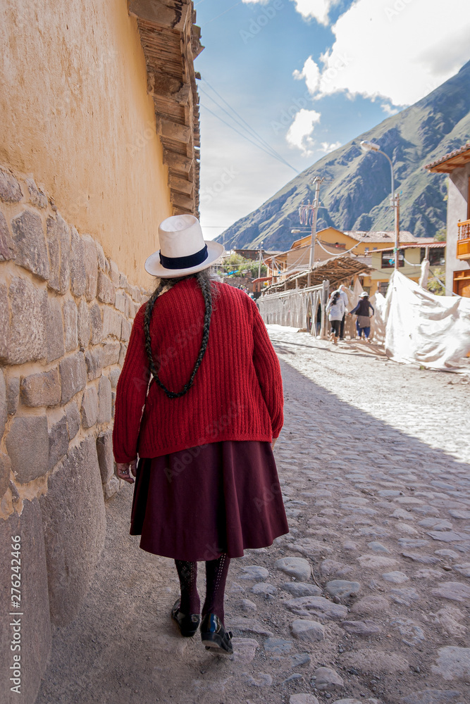 Old woman in Peru with typical hair tied behind her back