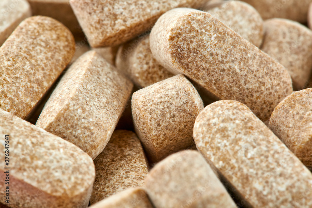 Close-up photo of many brown pills. Medicine Close-up photo of many brown pills. Medicine