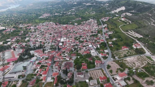 Inspiring aerial view of the beautiful famous Pano Lefkara village on the hilly Cyprus island. Stunning orange cityscape located in nature landscape between mountains. Summer vacation. photo