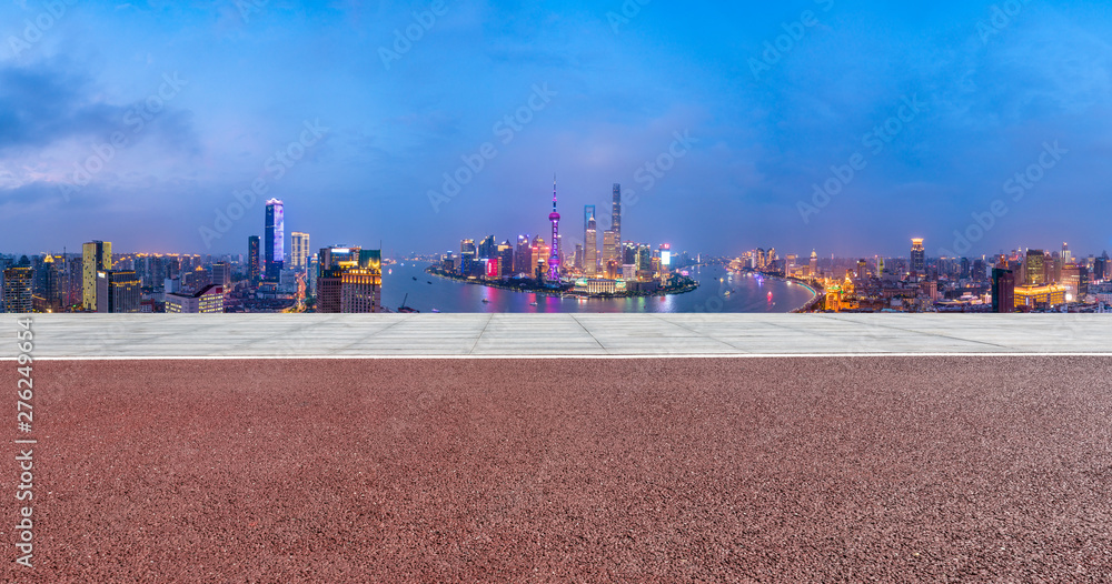 Shanghai skyline aerial panoramic view with empty floor at night,China