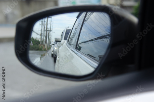 Car in the side mirror © khunkornStudio