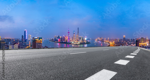 Shanghai skyline panoramic view with asphalt highway at night China