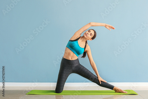Sporty woman practicing yog...