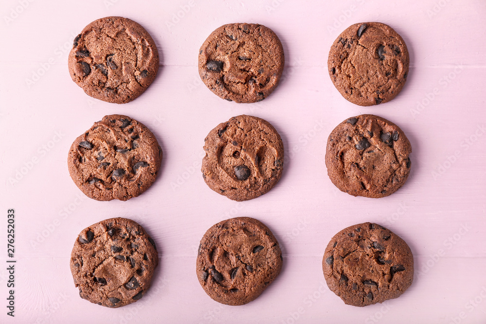 Tasty chocolate cookies on color background Tasty chocolate cookies on color background