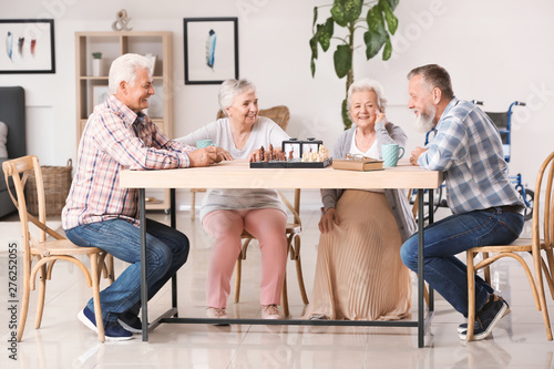 Elderly people playing ches...