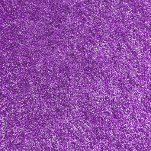 Purple abstract background. Purple grass texture. Texture of purple fur. Artificial color fur. Fur in the interior.  Vegan fur. Protection of animals.