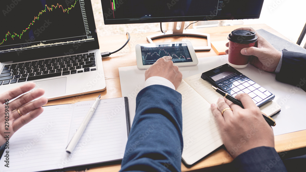 Fototapeta premium Business Team Investment Entrepreneur Trading discussing and analysis data the stock market charts and graphs negotiation and research budget, teamwork traders