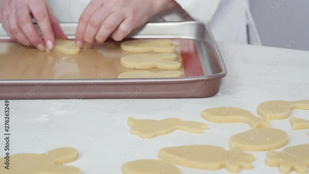 Time lapse. Step by step. Unbaked Easter sugar cookies arranged for baking on a baking sheet. Time lapse. Step by step. Unbaked Easter sugar cookies arranged for baking on a baking sheet.
