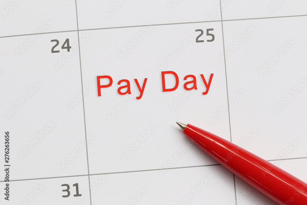 Red pen point to a empty space on the calendar and have Pay day text. Red pen point to a empty space on the calendar and have Pay day text.