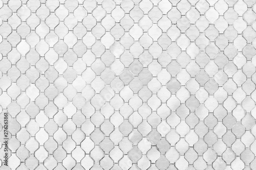 surface of the white tiles wall.