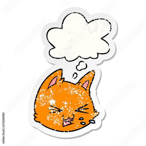 spitting cartoon cat face and thought bubble as a distressed worn sticker