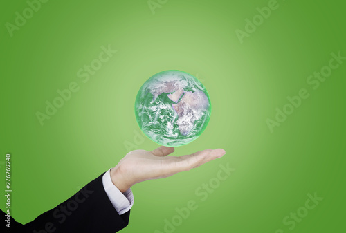 Fototapeta Naklejka Na Ścianę i Meble -  Earth day, Protect the world with environment and Eco-friendly business. Businessman hand holding green globe. Element of this image are furnished by NASA