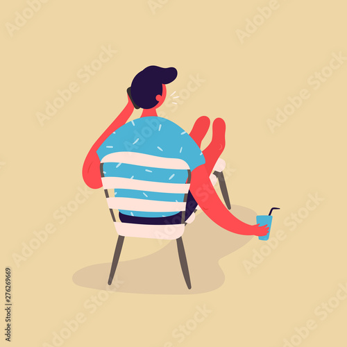 A man rest on a chaise longue with water and phone