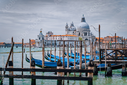 Venice view on Santa Maria della Salute basilica and gondolas on the Grand canal. Famous tourist attraction, summer city trip