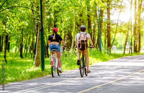 Cyclists ride on the bike path in the city Park 