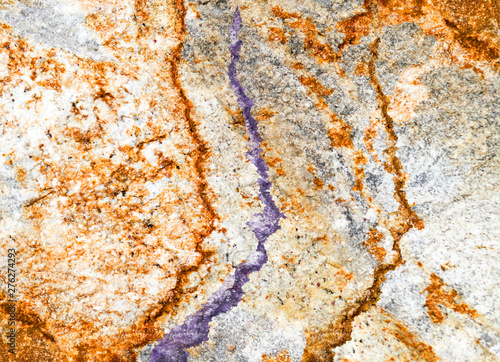 Colorful abstract background. Macro texture of stones. Surface of marble. Orange, grey. brown, colors. Modern poster, print, web design.Gemstone. Creative and unusual backdrop. Image.