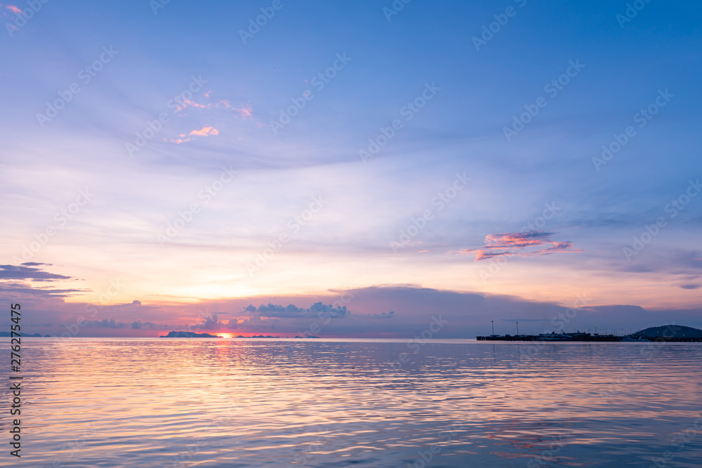 Panoramic tropical  purple sky blue sea sunset with golden light background ,Koh samui pier Thailand