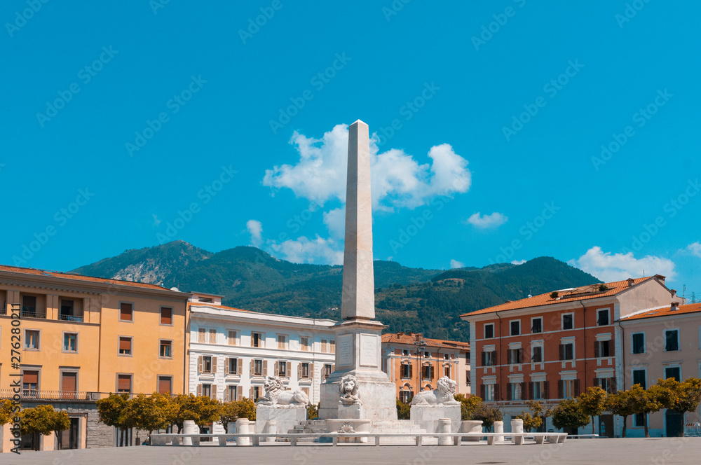 Massa, Tuscany. Piazza Aranci (oranges square), the city's main square, characterized by a double row of orange trees, the obelisk in the center of the square and the ducal palace.