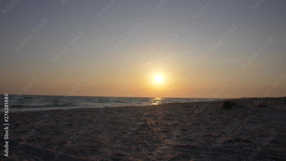 sunset over the sea and deserted beach sunset over the sea and deserted beach