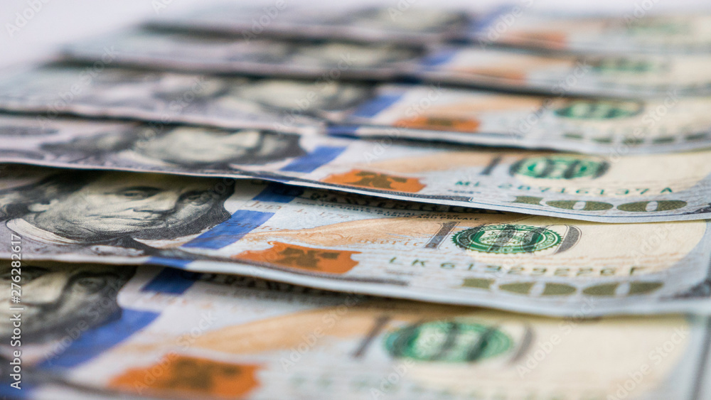 One hundred dollar bills close-up. One hundred dollar bills close-up.