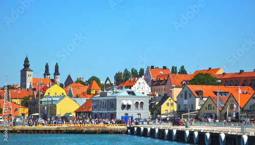 View from Port onto old town of Visby, Gotland with cathedral and historic buildings and masses of tourist photo