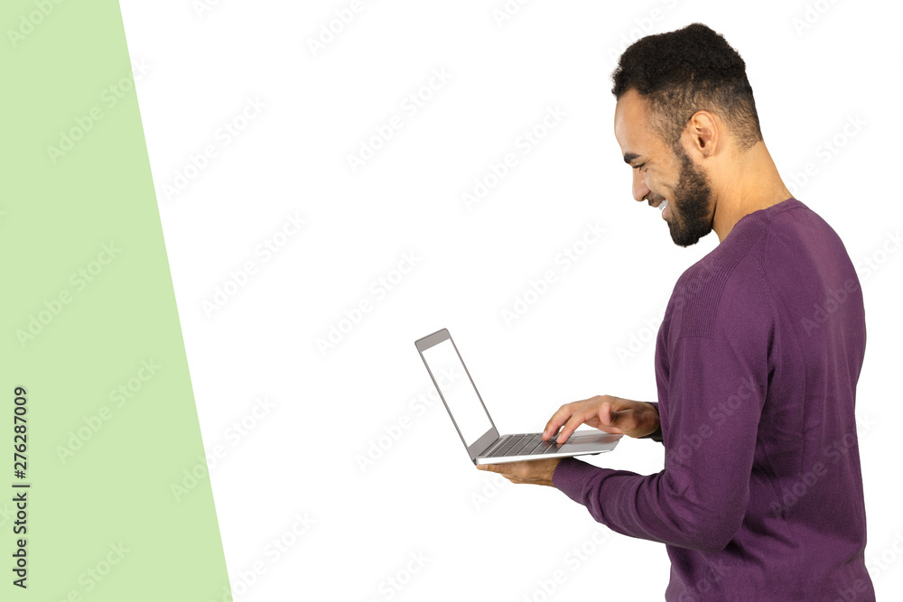 Image of african american businessman working on his laptop. Handsome young man