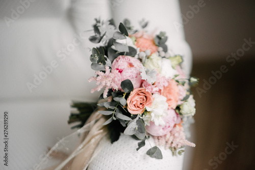 Bridal bouquet of flowers of the bride close up © Alexander