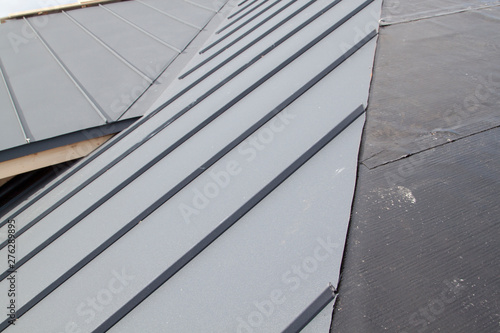 close up view of grey folding roof under construction on waterproofing layer