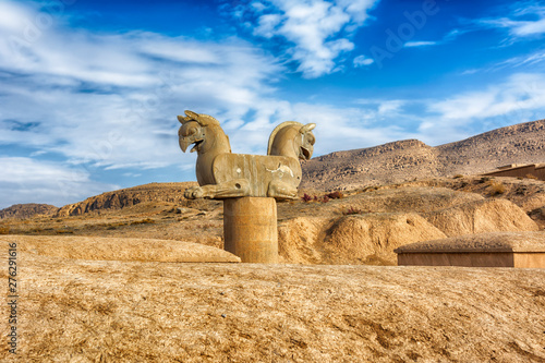 Persian Griffin, Persepolis. Iran is the capital of the Achaemenids. The ancient city of the Persians. Bright majestic monuments. Blue sky and clouds background.