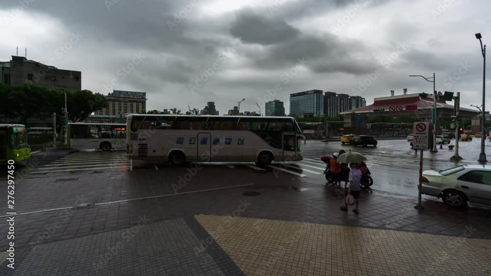time lapse of urban life with falling rain near the Taipei Main Station in Taipei, Taiwan