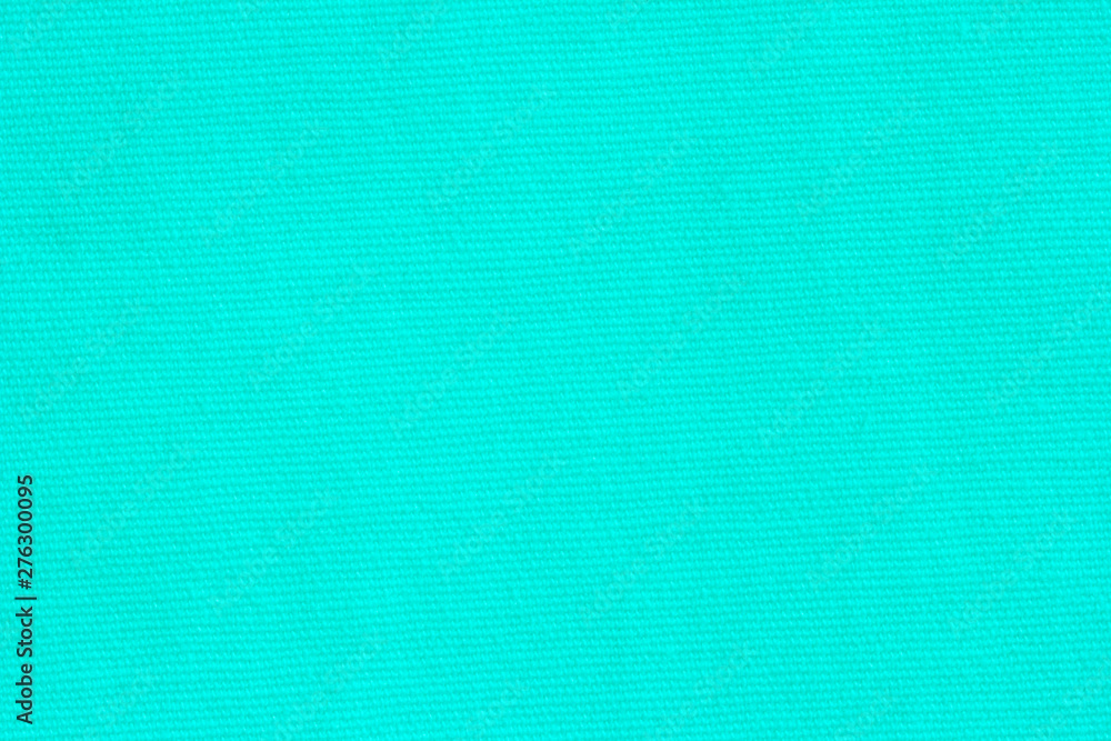 Turquoise canvas texture for background with visible fibers. Turquoise canvas texture for background with visible fibers.