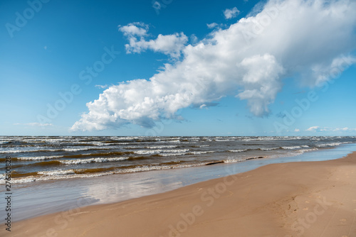 Fototapeta Naklejka Na Ścianę i Meble -  Beautiful seascape, Baltic Sea coast in Latvia, white sand and clouds