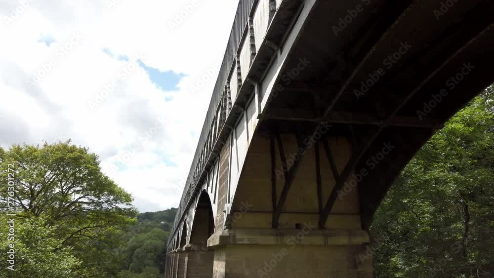 Pontcysyllte Aqueduct below historic bridge in Llangollen, North Wales, UK. Pan right to under arch. Pontcysyllte Aqueduct below historic bridge in Llangollen, North Wales, UK. Pan right to under arch.
