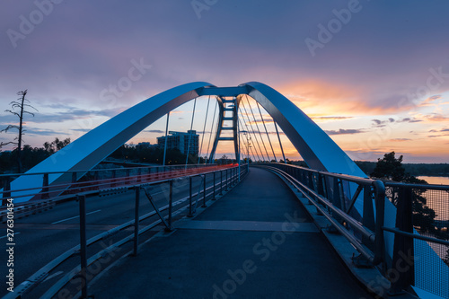 light trails on bridge at sunset
