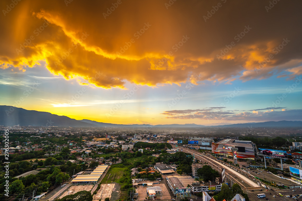 CHIANG MAI , THAILAND- JUNE 22, 2019 : Rain in the bright sky at the high angle of Chiang Mai cityscape and Doi Suthep as a background