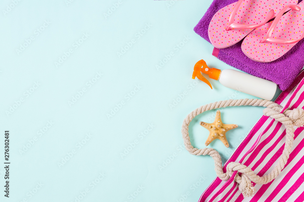 Summer bag background with copy space. Flat lay photo on color table, travel concept. Free space for text, mock-up Summer bag background with copy space. Flat lay photo on color table, travel concept. Free space for text, mock-up