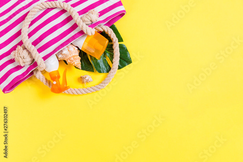 Summer bag background with copy space. Flat lay photo on color table, travel concept. Free space for text, mock-up