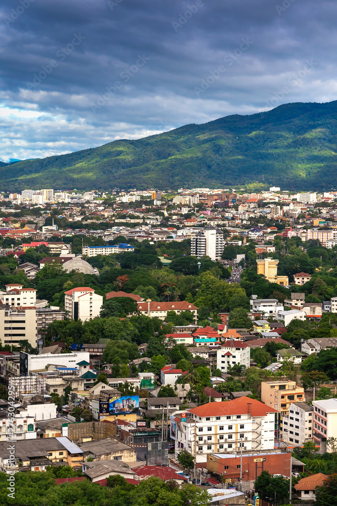 Fototapeta premium CHIANG MAI , THAILAND- JUNE 28, 2019 : Colorful hot-air balloons flying over Chiang Mai City with Doi Suthep Mountain background in Chiang Mai, Thailand.