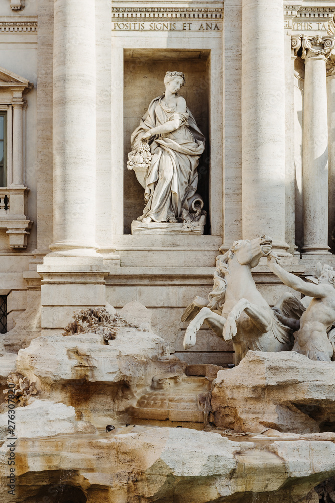 Detail statue of Abundance, Trevi Fountain (Fontana di Trevi) in Rome, Italy.