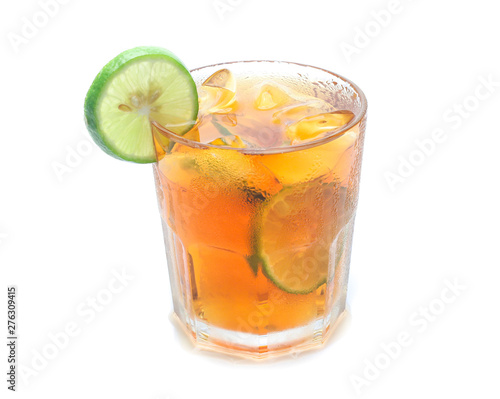 glass of iced tea with lemons isolated on a white background