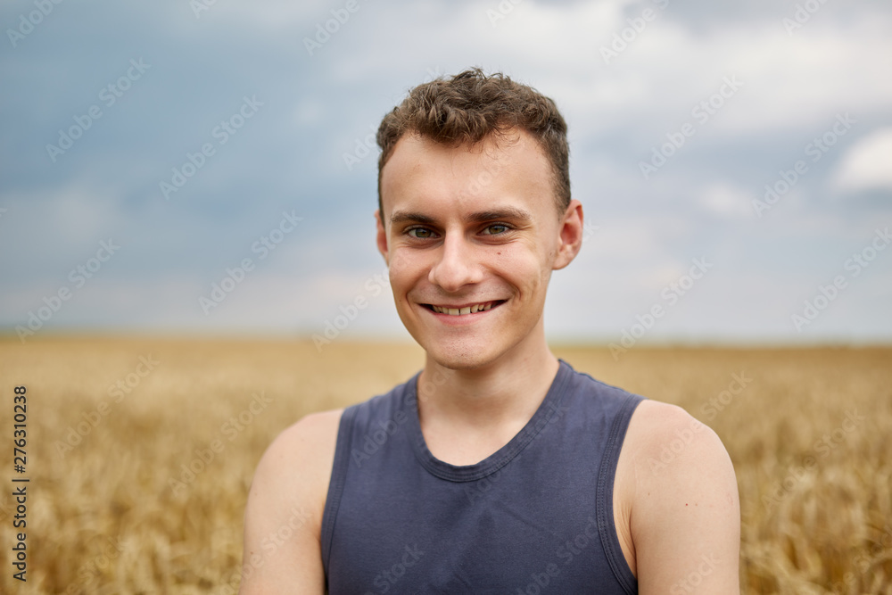 Young farmer in wheat field Young farmer in wheat field