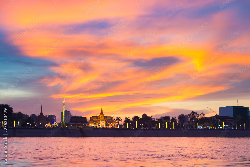 Phnom Penh skyline at sunset capital city of Cambodia kingdom, panorama silhouette view  from Mekong river, travel destination, dramatic sky